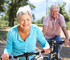 Older couple biking